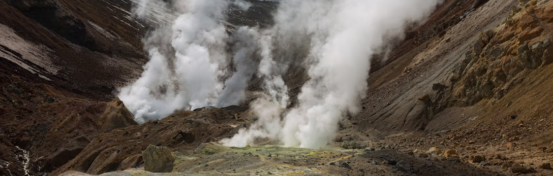geothermal field blowing up steam